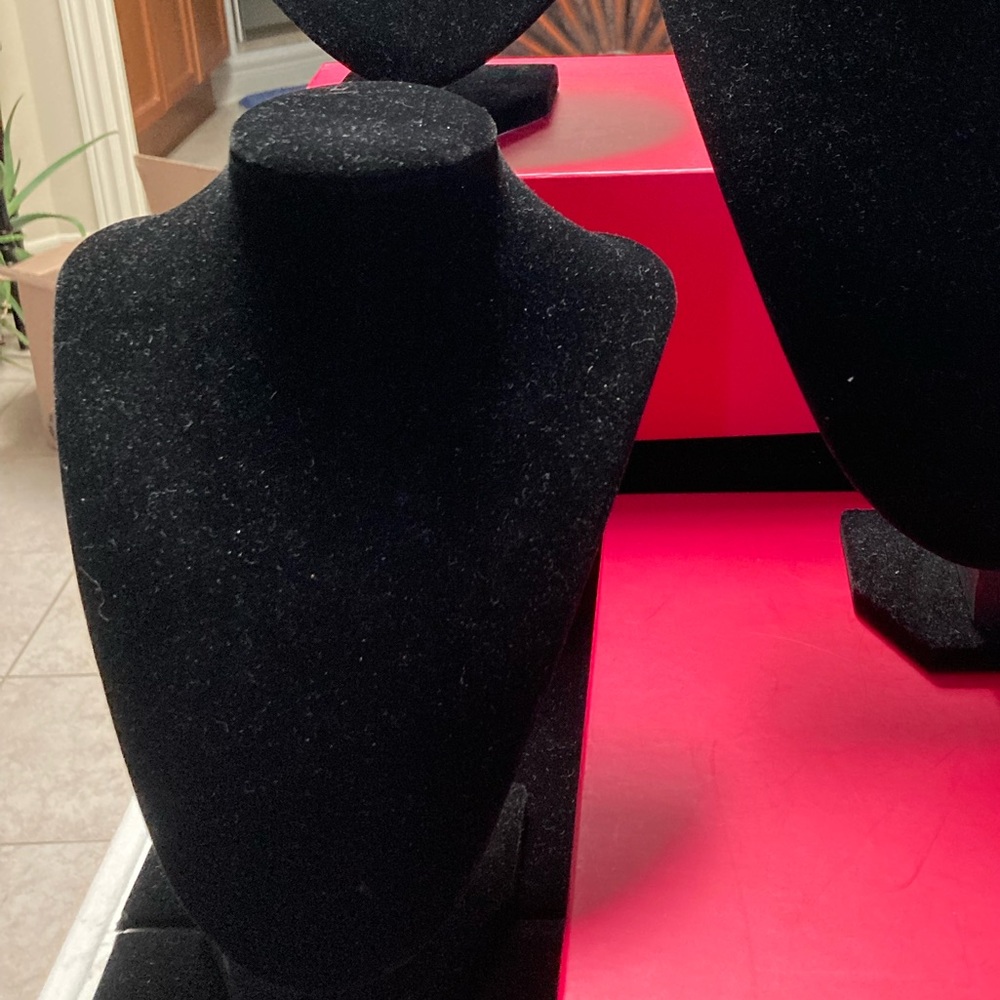9” high black faux velvet display stand.